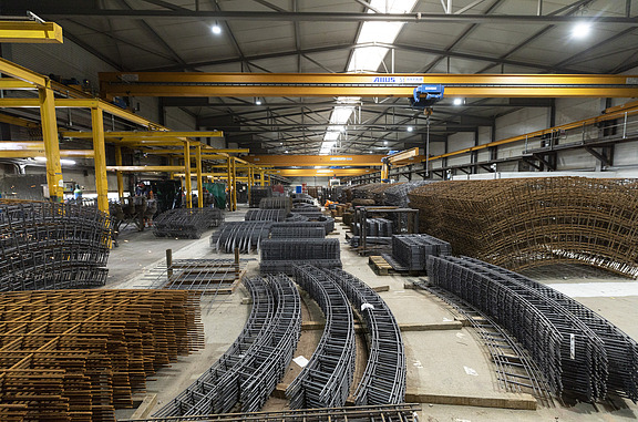 Inside of the steel hall with some of the steel cage components