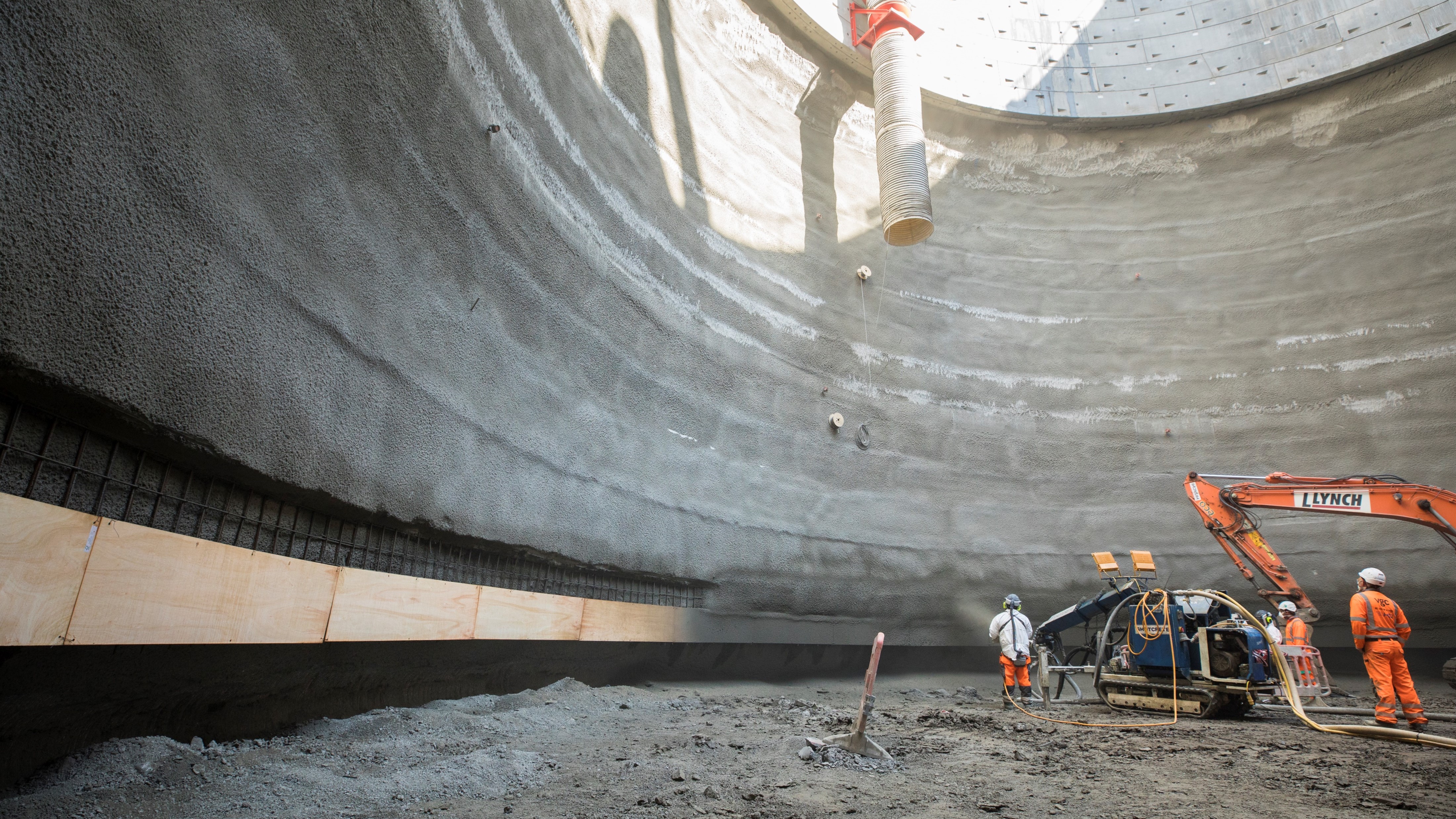 Concrete being sprayed in a shaft