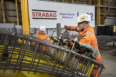 Man constructing the steel frame component of a segment