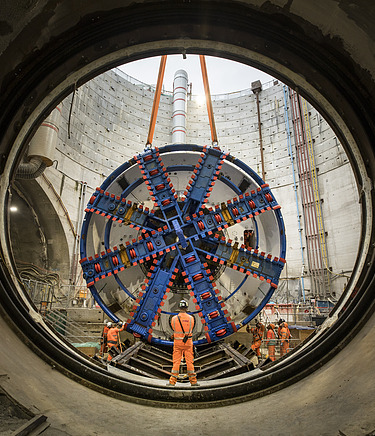 TBM cutterhead being lowered into a shaft