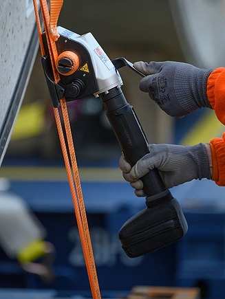 A strap around a tunnel segment being tightened 