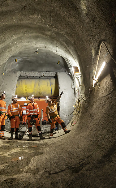 Four people on site inside a tunnel