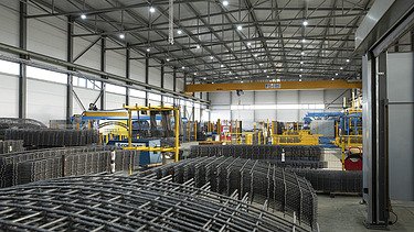 Inside the steel hall showing the steel cages