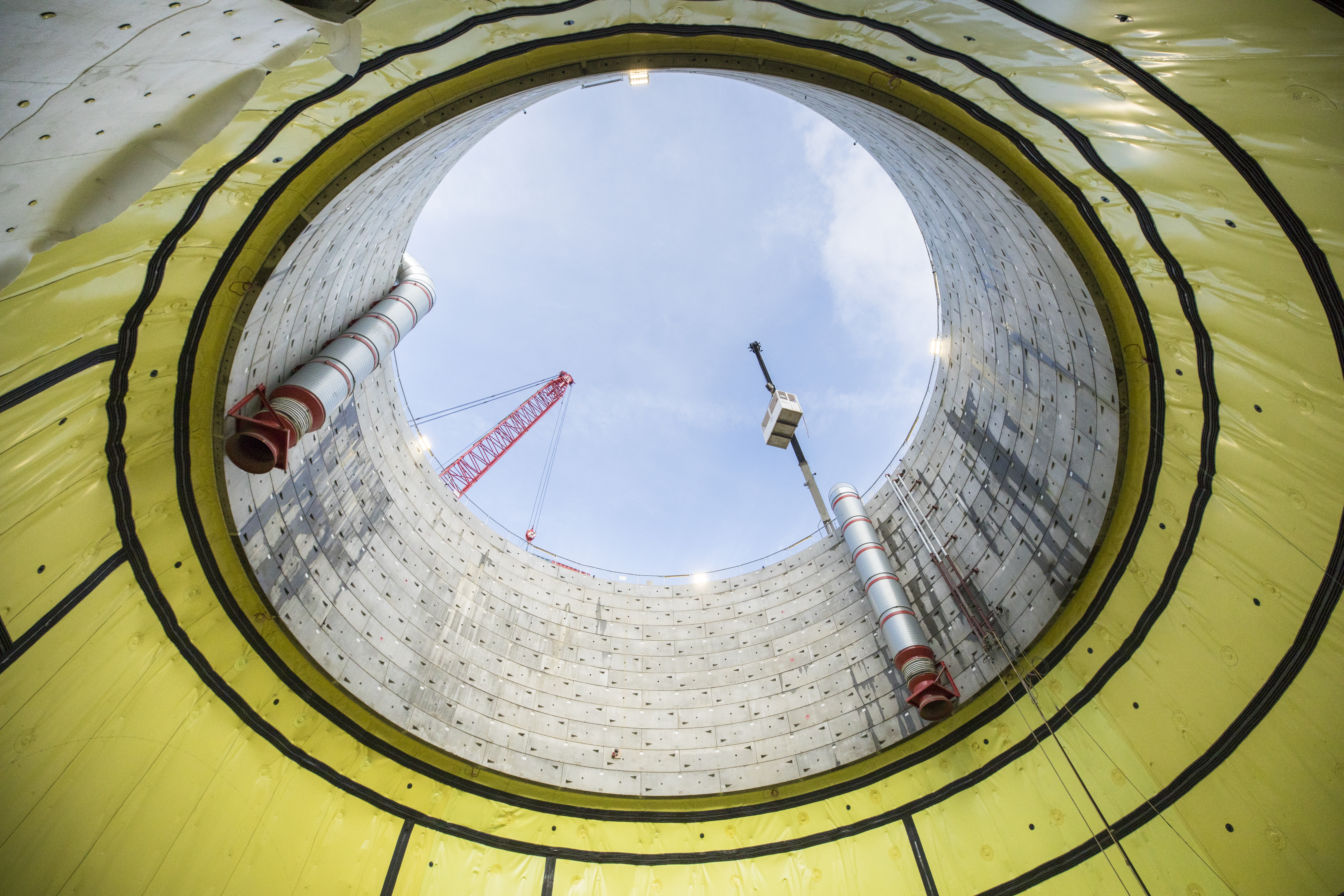 View from the bottom of a shaft looking at the sky with full view of the waterproofing