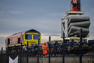 Tunnel segments being loaded onto a train to be transported to London