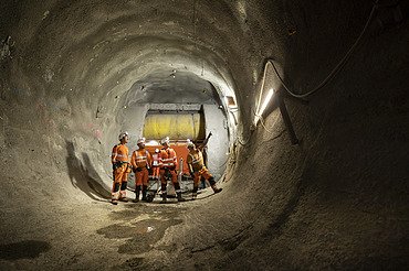 Four people on site inside a tunnel
