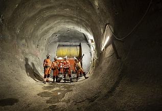 Four people on site inside a tunnel